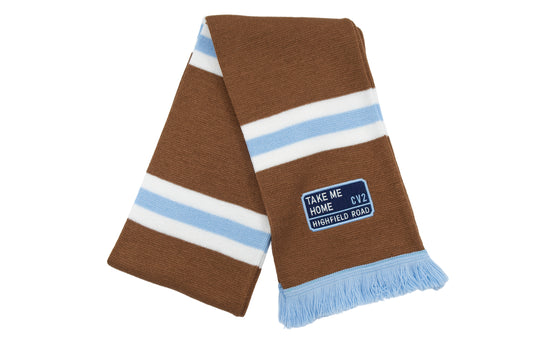 Milk chocolate scarf with navy blue embroidered badge